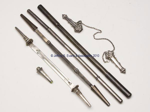 SILVER-LIKE KNITTING NEEDLE ACCESSORIES, LOT OF FI: SILVER-LIKE KNITTING NEEDLE ACCESSORIES, LOT OF FIVE, probably unmarked sterling silver, consisting of a Continental pair joined by a chain; two cases with central section containing a sliding mechani