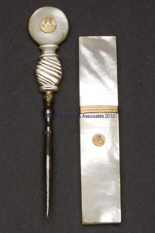 MOTHER-OF-PEARL PALAIS ROYAL SEWING ARTICLES, LOT: MOTHER-OF-PEARL PALAIS ROYAL SEWING ARTICLES, LOT OF TWO, each with enameled brass insert with pansy decoration, consisting of a rectangular-form needle case and a stiletto with ribbing to lower handl