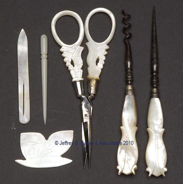 MOTHER-OF-PEARL NEEDLEWORKING TOOLS, LOT OF SIX: MOTHER-OF-PEARL NEEDLEWORKING TOOLS, LOT OF SIX, consisting of two stilettos, bodkin, corkscrew, figural silk winder, and a pair scissors. Mid to late 19th century. 2 3/8" to 4 1/2" h overall. Provena