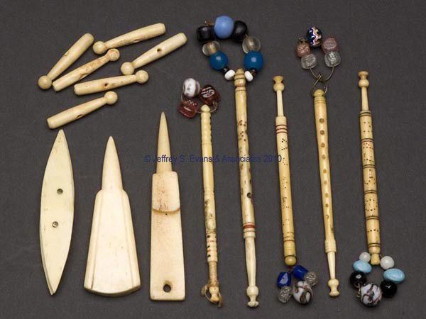 BONE / IVORY NEEDLEWORKING TOOLS, LOT OF 14: BONE / IVORY NEEDLEWORKING TOOLS, LOT OF 14, consisting of five lace bobbins, each with a name, two stilettos, shuttle, and six other articles. Third quarter 19th century. Various sizes. Provenance: C
