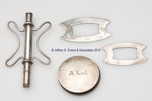 STERLING SILVER AND SILVER-LIKE SILK WINDERS, LOT: STERLING SILVER AND SILVER-LIKE SILK WINDERS, LOT OF FOUR, three sterling silver examples consisting of two Simons Bros. examples and a S. C. & L. Co. disk form with monogram; and an unmarked combinat