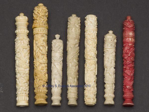 CARVED BONE / IVORY NEEDLE CASES, LOT OF SEVEN: CARVED BONE / IVORY NEEDLE CASES, LOT OF SEVEN, cylindrical forms heavily carved with various patterns, including three with various birds, butterfly, and a red stained example. Third quarter 19th cen