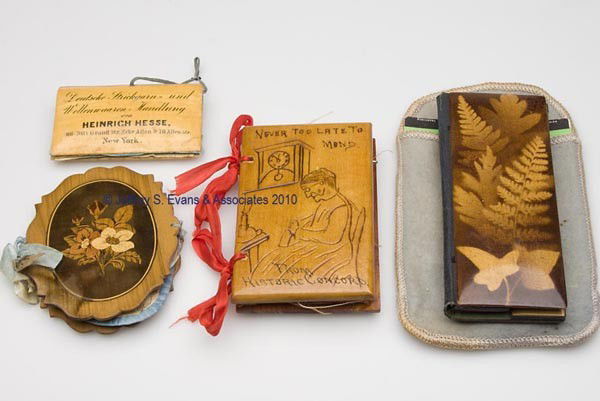 DECORATED WOODEN NEEDLE CASES, LOT OF FOUR: DECORATED WOODEN NEEDLE CASES, LOT OF FOUR, consisting of two examples with foliage decoration including a lacquered fernware with sleeves for needle packets and a foliage inlaid example; a lacquered