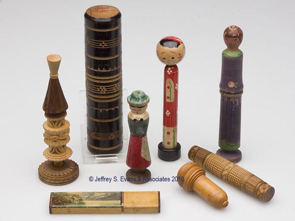WOODEN NEEDLE CASES, LOT OF EIGHT: WOODEN NEEDLE CASES, LOT OF EIGHT, consisting of two carved examples, three figural children examples with paint decoration, an acorn form, a black lacquered with engraved bands, and a rectangular exa