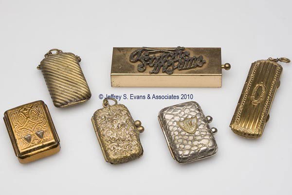 VARIOUS METAL NEEDLE CASES, LOT OF SIX: VARIOUS METAL NEEDLE CASES, LOT OF SIX, consisting of three purse-form examples, including two with a link for chatelaine; a rectangular brass-plated example with floral and foliage edges; a brass-dra