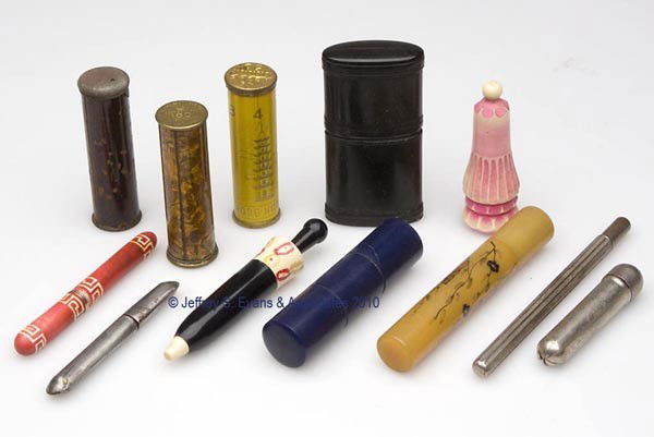 VARIOUS METAL AND CELLULOID / PLASTIC NEEDLE CASES: VARIOUS METAL AND CELLULOID / PLASTIC NEEDLE CASES, LOT OF 12, consisting of seven assorted metal examples including three with a revolving dial for various sizes, and five celluloid/plastic examples