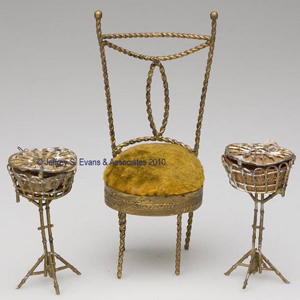 TWISTED METAL WIRE FIGURAL PIN CUSHIONS, LOT OF TW: TWISTED METAL WIRE FIGURAL PIN CUSHIONS, LOT OF TWO, depicting side chairs, consisting of an example with brass finish and original yellow velvet pin cushion seat, and a heart-form-back example with l