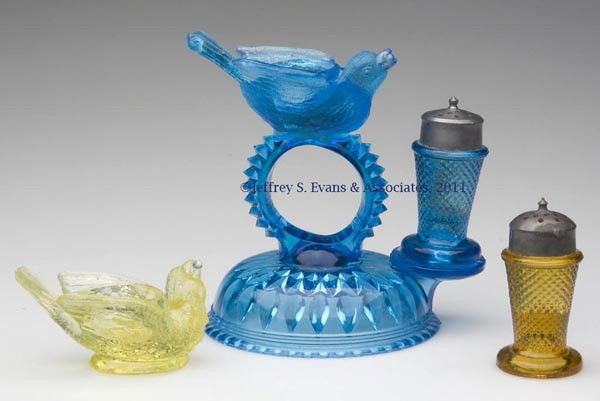 BIRD WITH BERRY NAPKIN RING: BIRD WITH BERRY NAPKIN RING, blue, salt cellar mounted on top with a pepper shaker with period lid on the front, circular domed base having pressed diamonds and teardrops underneath Together with a va