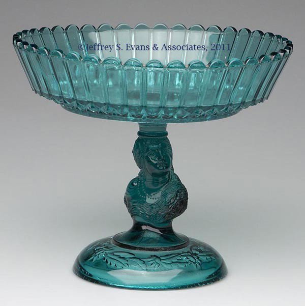 COLUMBIA / JENNY LIND OPEN COMPOTE: COLUMBIA / JENNY LIND OPEN COMPOTE, teal green, Flute bowl with scalloped rim, figural stem and circular foot with embossed floral band underneath, wafer construction. Challinor, Taylor & Co. Fourth q