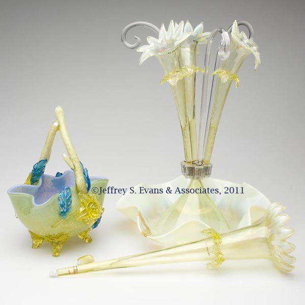 VICTORIAN GLASS ARTICLES, LOT OF TWO: VICTORIAN GLASS ARTICLES, LOT OF TWO, comprising a vaseline opalescent four-trumpet epergne with three canes, and a cased-vaseline and blue basket with mica flecks, applied vaseline and blue floral de