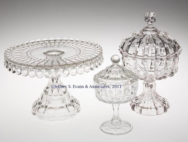 VARIOUS EAPG TABLE ARTICLES, LOT OF THREE: VARIOUS EAPG TABLE ARTICLES, LOT OF THREE, colorless, comprising a Broken Column covered compote, and a Priscilla cake stand and covered jelly compote. Fourth quarter 19th century. 6 3/4" to 10" HOA. 