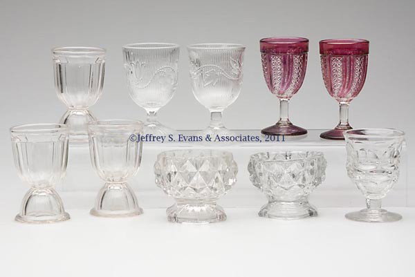 VARIOUS EAPG ARTICLES, LOT OF TEN: VARIOUS EAPG ARTICLES, LOT OF TEN, colorless, comprising two Feather Variant with maiden's blush wines, an Argus single and three paneled double egg cups, together with two other egg cups and two open