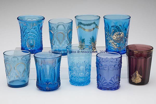 VARIOUS EAPG TUMBLERS, LOT OF NINE: VARIOUS EAPG TUMBLERS, LOT OF NINE, amethyst and blue, seven with some gilt decoration, comprising a Dandelion with Northwood mark, Iris with Meander, Regent/Leaf Bracket, two Scroll with Acanthus wit