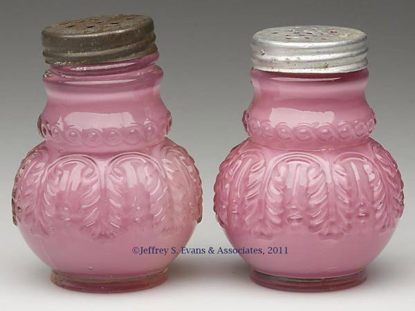 NORTHWOOD'S NO. 263 / LEAF UMBRELLA PAIR OF SALT A: NORTHWOOD'S NO. 263 / LEAF UMBRELLA PAIR OF SALT AND PEPPER SHAKERS, cased Rose Du Barry/cased pink, period lids. Northwood Glass Co. Fourth quarter 19th century. 3" to 3 1/8" HOA. Provenance: Persona
