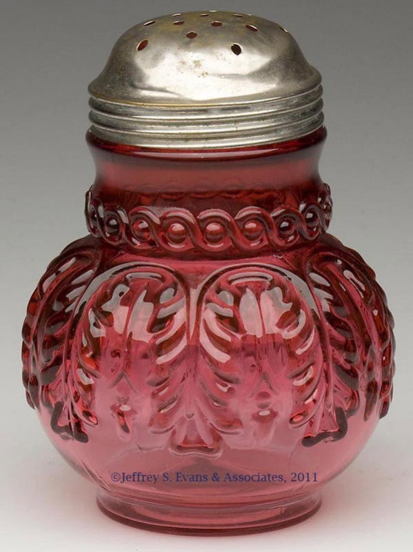 NORTHWOOD'S NO. 263 / LEAF UMBRELLA SUGAR SHAKER: NORTHWOOD'S NO. 263 / LEAF UMBRELLA SUGAR SHAKER, Ruby/cranberry, period lid. Northwood Glass Co. Fourth quarter 19th century. 4 1/2" HOA. Provenance: Personal collection of Judith (Judy) Cronin, Orle