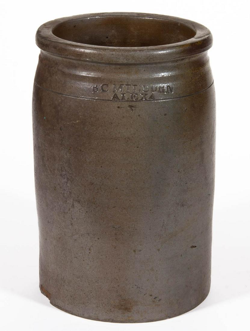 STAMPED "B.C MILBURN / ALEXA", ALEXANDRIA, VIRGINIA: STAMPED "B.C MILBURN / ALEXA", ALEXANDRIA, VIRGINIA STONEWARE JAR, salt-glazed, sideways "1" gallon capacity, cylindrical form with round flat-top rim, collared neck, and incised shoulder ring. Benedi