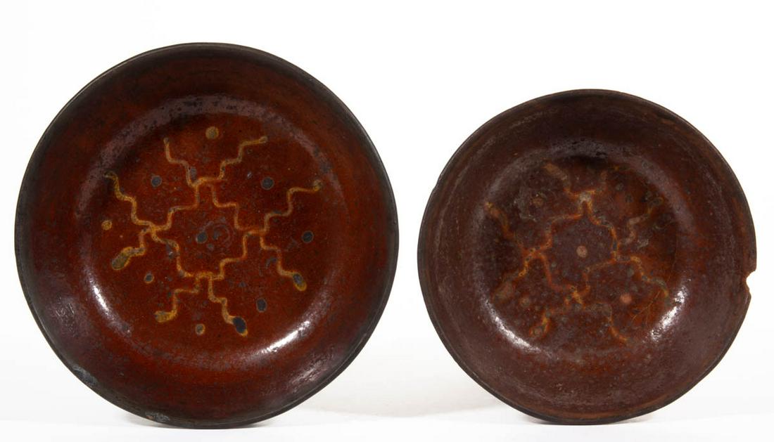 AMERICAN DECORATED EARTHENWARE / REDWARE DISHES, LOT OF: AMERICAN DECORATED EARTHENWARE / REDWARE DISHES, LOT OF TWO, single lead-glazed, each having plain rim and yellow-slip trailed design featuring four abstract slithering wavy lines with dots. Possibly