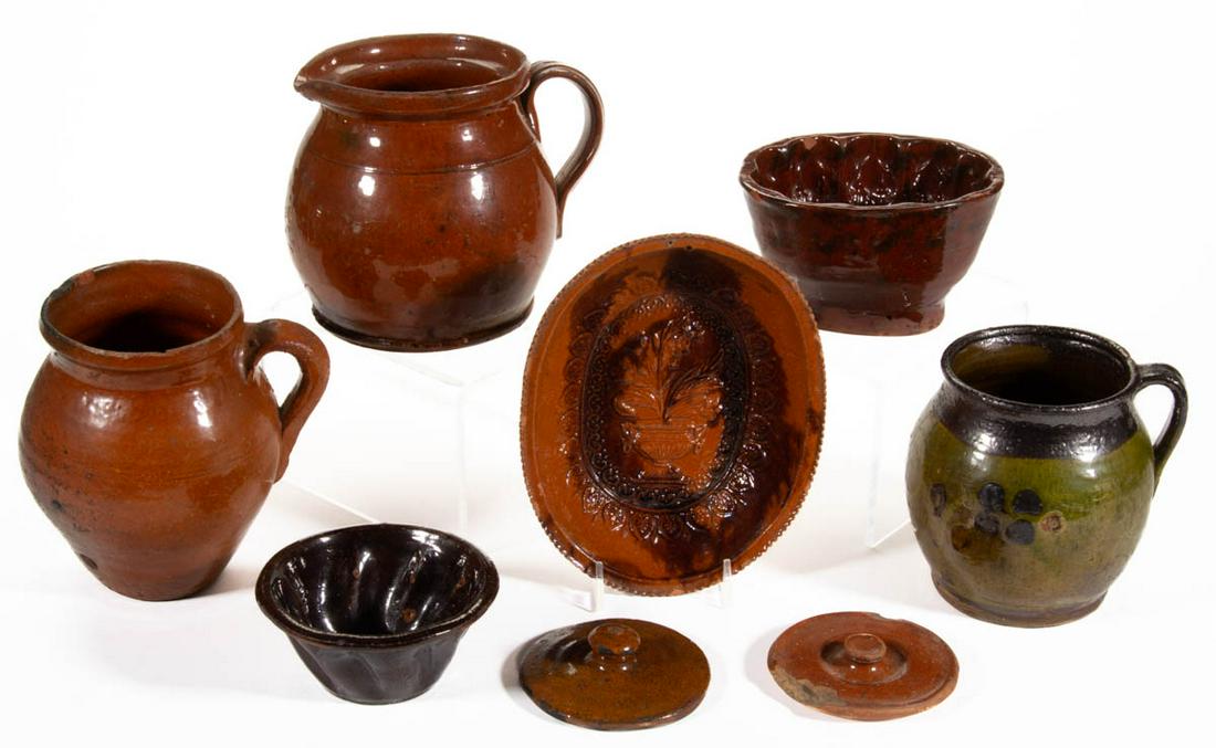 AMERICAN AND OTHER EARTHENWARE / REDWARE ARTICLES, LOT: AMERICAN AND OTHER EARTHENWARE / REDWARE ARTICLES, LOT OF SEVEN, comprising three food molds including two with floral motif, three jugs including two lead-glazed examples and one example having a sli