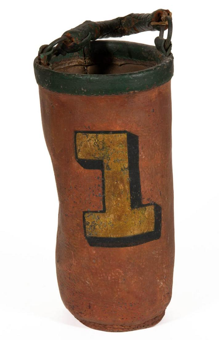 AMERICAN LEATHER FIRE BUCKET: AMERICAN LEATHER FIRE BUCKET, with a ringed bail handle, featuring the number "1". Retains an old polychrome painted surface. 19th century. 14" H rim. Provenance: From the estate of David Proctor, Sta