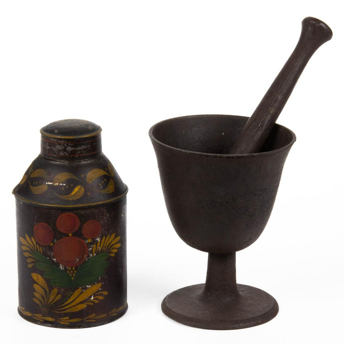 SOUTHWESTERN VIRGINIA CAST-IRON MORTAR AND PESTLE: SOUTHWESTERN VIRGINIA CAST-IRON MORTAR AND PESTLE, purportedly from McClean's Rexall Drugstore in Pearisburg, Virginia, Together with a paint-decorated toleware tea caddy. Two pieces total. 19th centu