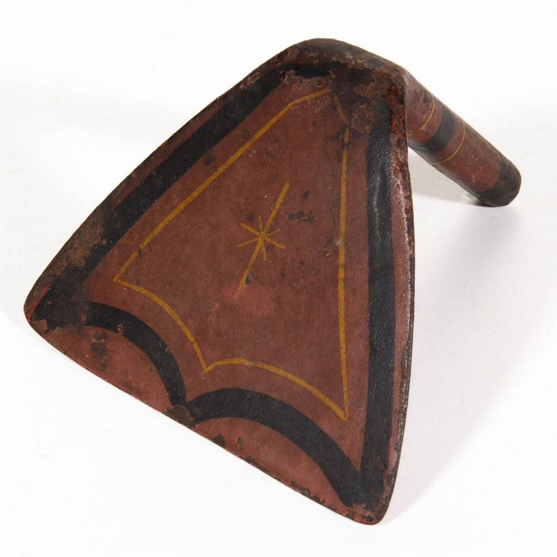 PAINT-DECORATED WROUGHT-IRON DOUGH SCRAPER: PAINT-DECORATED WROUGHT-IRON DOUGH SCRAPER, triangular-form blade, retains an old red-painted surface with black and yellow pinstriping to handle and underside. 19th century. 2 1/2" H, 4 1/2" L. Prove