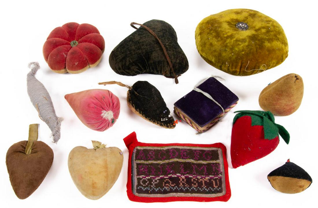 ASSORTED VELVET / FABRIC SEWING PIN CUSHIONS AND OTHER: ASSORTED VELVET / FABRIC SEWING PIN CUSHIONS AND OTHER ARTICLES, LOT OF 13., including mouse, heart and fruit examples, and a Berlin work needlework alphabet sampler. Fourth quarter 19th/early 20th ce