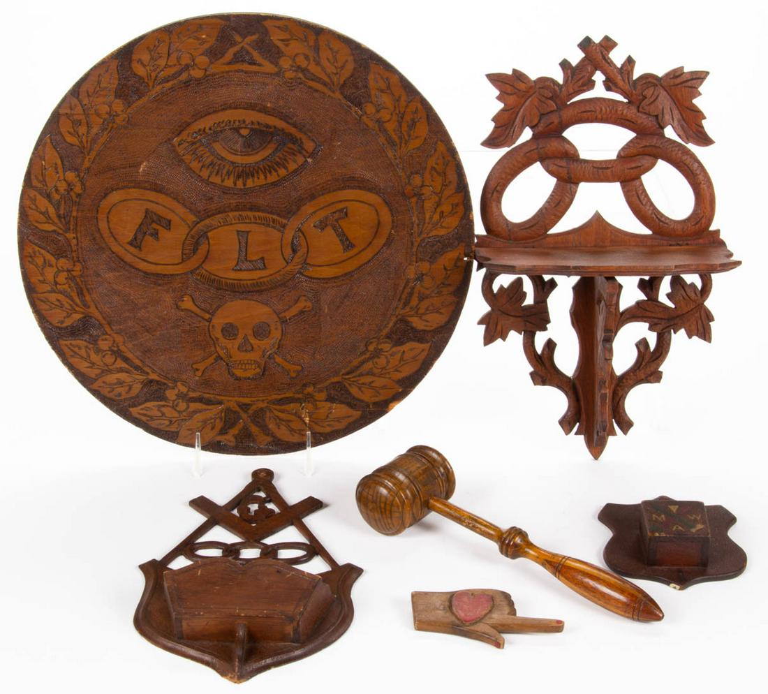 AMERICAN ODD FELLOWS / LODGE FOLK ART CARVED AND: AMERICAN ODD FELLOWS / LODGE FOLK ART CARVED AND PAINTED WOODEN ARTICLES, LOT OF SIX, including pyrography plaque depicting an eye and skull with crossbones, wall shelf / match holder dated 1876, and 