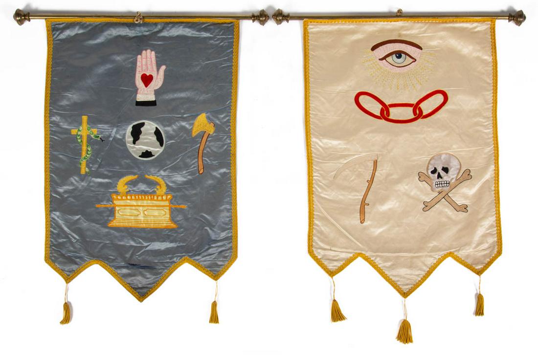 AMERICAN ODD FELLOWS / LODGE SILK EMBROIDERED BANNERS,: AMERICAN ODD FELLOWS / LODGE SILK EMBROIDERED BANNERS, LOT OF TWO, comprising one with heart-in-hand, globe, and arc of the covenant against a blue backdrop, and other example with skull with crossbon