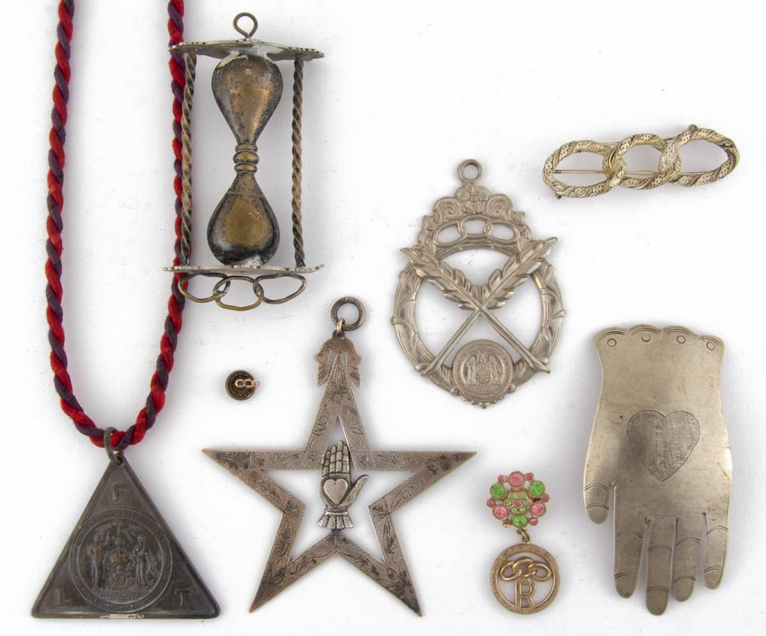 ODD FELLOWS SILVER-PLATED AND OTHER JEWELS AND JEWELRY,: ODD FELLOWS SILVER-PLATED AND OTHER JEWELS AND JEWELRY, LOT OF EIGHT, comprising a silver or silver-plated Past Grand jewel featuring a heart-in-hand in the center of a five-point star with engraved d
