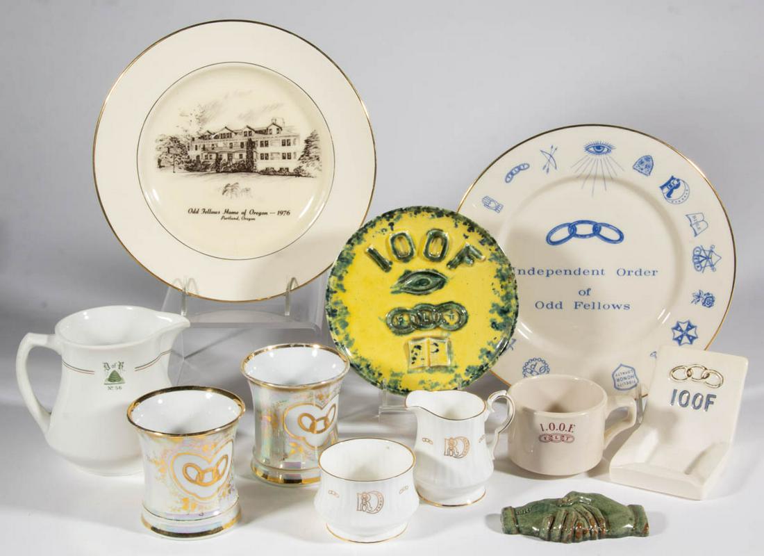 ASSORTED ODD FELLOWS / LODGE CERAMIC ARTICLES, LOT OF: ASSORTED ODD FELLOWS / LODGE CERAMIC ARTICLES, LOT OF 10, including two mugs featuring three-linked to front with iridescent and gilt decoration, an ashtray and cigarette holder with gilt relief three
