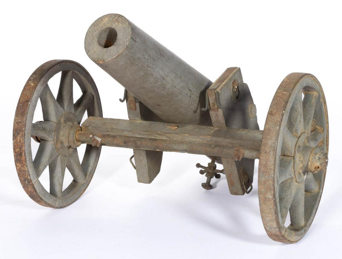 MID-ATLANTIC FOLK ART CIVIL WAR-STYLE PAINTED: MID-ATLANTIC FOLK ART CIVIL WAR-STYLE PAINTED MIXED-WOOD TOY FIELD CANON, a detailed, finely crafted example, featuring delineated sight and vent, supported by a carriage resting on an iron rod axle c