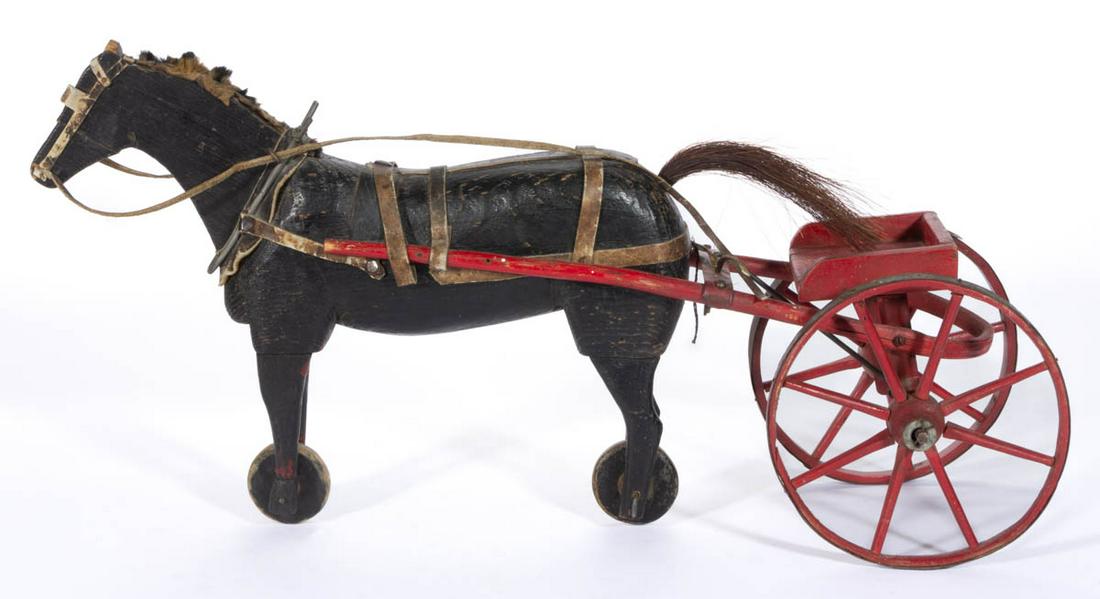 AMERICAN FOLK ART CARVED AND PAINTED FIGURAL HORSE AND: AMERICAN FOLK ART CARVED AND PAINTED FIGURAL HORSE AND SULKY PULL TOY, full-figured horse with fitted wooden wheels, attached to a sulky with sheet-iron and wooden wheels. retaining early, likely orig