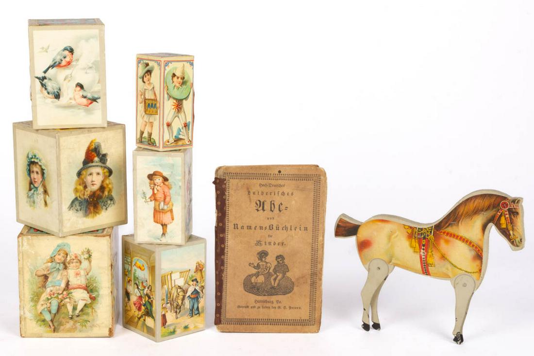 ASSORTED CHILD'S LITHOGRAPHED AND OTHER TOYS, LOT OF: ASSORTED CHILD'S LITHOGRAPHED AND OTHER TOYS, LOT OF EIGHT, comprising six German nesting blocks, a horse toy with tin legs by The Gibbs Mfg. Co. of Canton, OH, and a German ABC reader book printed an
