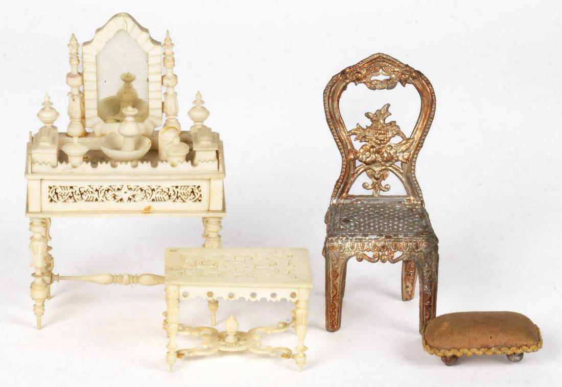 DOLLHOUSE / MINIATURE VANITY AND OTHER FURNITURE, LOT: DOLLHOUSE / MINIATURE VANITY AND OTHER FURNITURE, LOT OF FOUR, comprising a carved bone-like vanity table with mirror and matching stool, a cast-white metal Victorian-style side chair, and a footstool