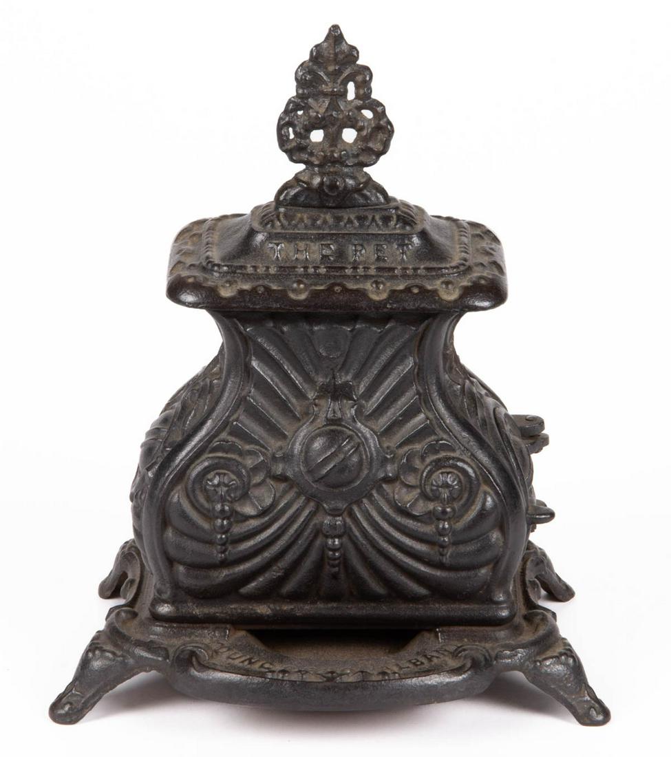 AMERICAN SALESMAN'S SAMPLE / STORE DISPLAY "THE PET": AMERICAN SALESMAN'S SAMPLE / STORE DISPLAY "THE PET" CAST-IRON HEATING/PARLOR STOVE, ornate form embossed "THE PET" and "PAT'D 1857" on top, and "YOUNG & BRO., ALBANY." on lower front plate, working h