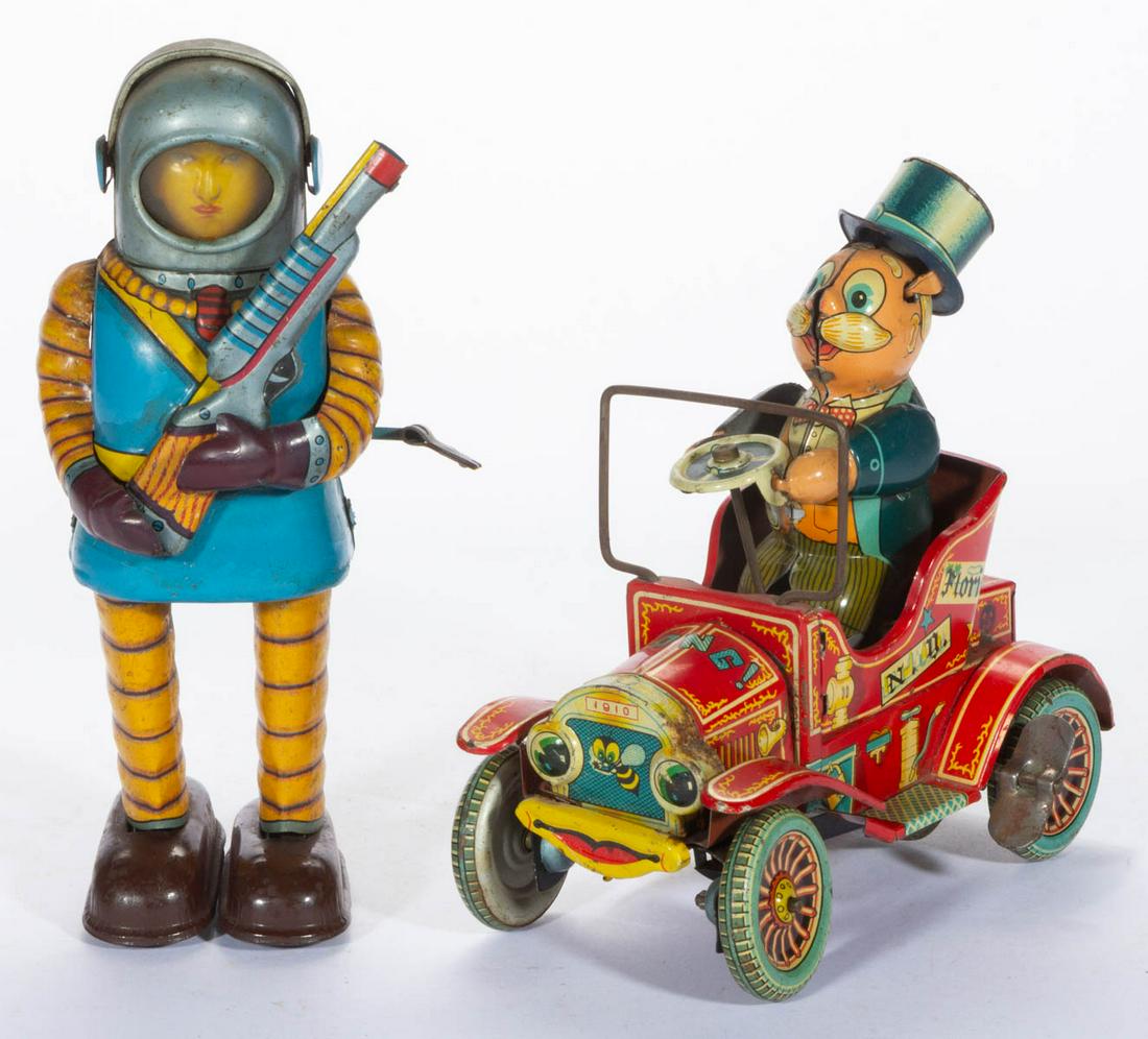 VINTAGE JAPANESE LITHOGRAPHED TIN WIND-UP TOYS, LOT OF: VINTAGE JAPANESE LITHOGRAPHED TIN WIND-UP TOYS, LOT OF TWO, each having wind-up mechanism to side, comprising a Yonezawa "Grand-pa's New Car" toy, and a Haji "Space Trooper" toy. Each with marks inclu