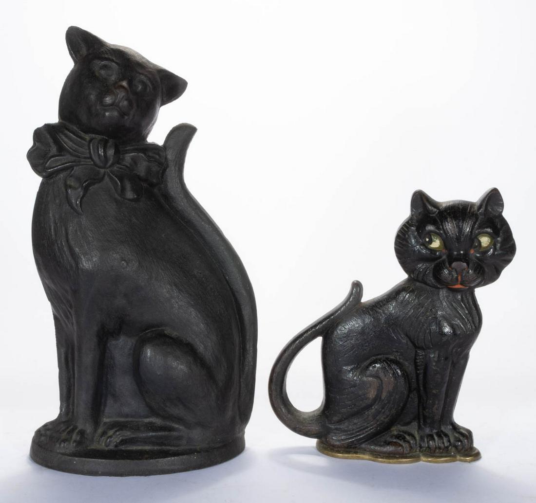 ASSORTED CAST-IRON FIGURAL SITTING CAT DOORSTOPS, LOT: ASSORTED CAST-IRON FIGURAL SITTING CAT DOORSTOPS, LOT OF TWO, comprising an original paint decorated A. M. Greenblatt Studio whimsical example, reverse embossed with makers name between "COPYRIGHT" an