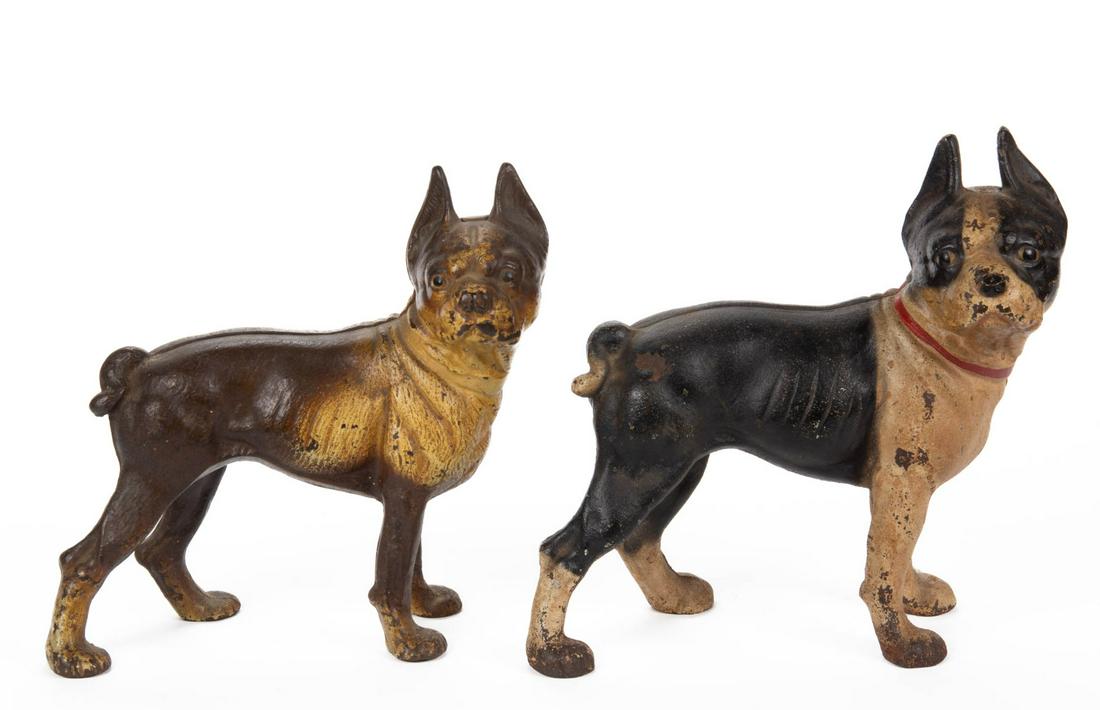 CAST-IRON BOSTON TERRIER DOORSTOPS, LOT OF TWO: CAST-IRON BOSTON TERRIER DOORSTOPS, LOT OF TWO, each facing to the right, no markings located. One example with possibly later red-painted collar. First half 20th century. 9" and 9 3/4" H. Provenance: