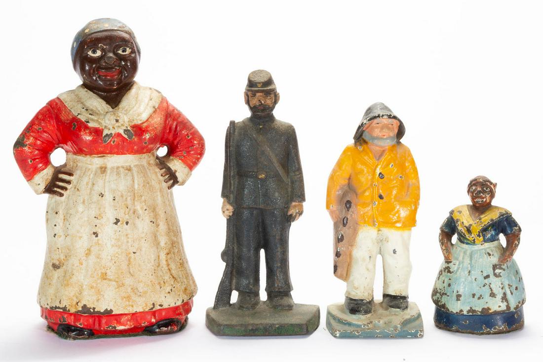 CAST-IRON FIGURAL DOORSTOPS, LOT OF FOUR: CAST-IRON FIGURAL DOORSTOPS, LOT OF FOUR, each full figure with original polychrome-painted finish, featuring two Mammy figures, a Civil War Soldier, and a Fisherman. Unmarked. 20th century. 4 1/4" to