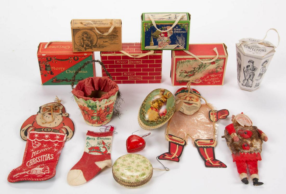 ANTIQUE / VINTAGE HOLIDAY AND CHRISTMAS CANDY: ANTIQUE / VINTAGE HOLIDAY AND CHRISTMAS CANDY CONTAINERS, LOT OF 14, comprising three lithographed molded pasteboard containers consisting of an egg with rabbit, a round shamrock example, and a small 