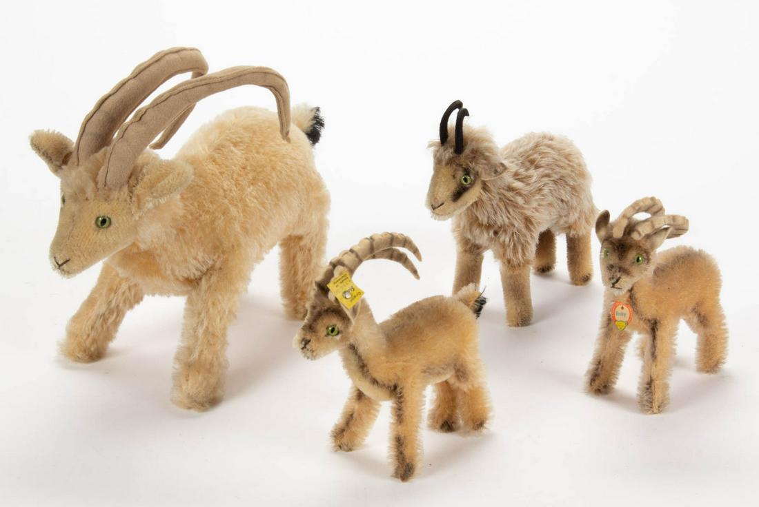 VINTAGE GERMAN STEIFF STUFFED MOUNTAIN GOATS, LOT OF: VINTAGE GERMAN STEIFF STUFFED MOUNTAIN GOATS, LOT OF FOUR, mohair in blonde and tan tones, each with bright green eyes and felt antlers, comprising three Rocky blonde examples, one small example with 