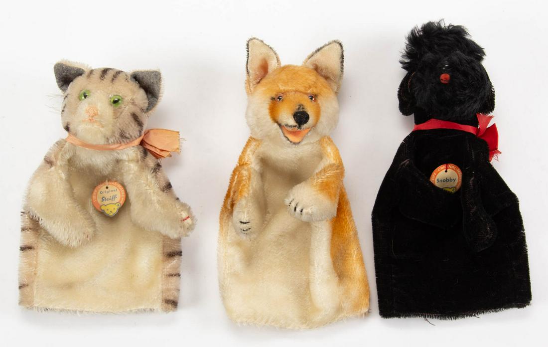 VINTAGE GERMAN STEIFF HAND PUPPETS, LOT OF THREE: VINTAGE GERMAN STEIFF HAND PUPPETS, LOT OF THREE, mohair, comprising a black Snobby poodle with red bow, retains original Steiff paper label; a kitty cat with bright green eyes and a pink bow, retains