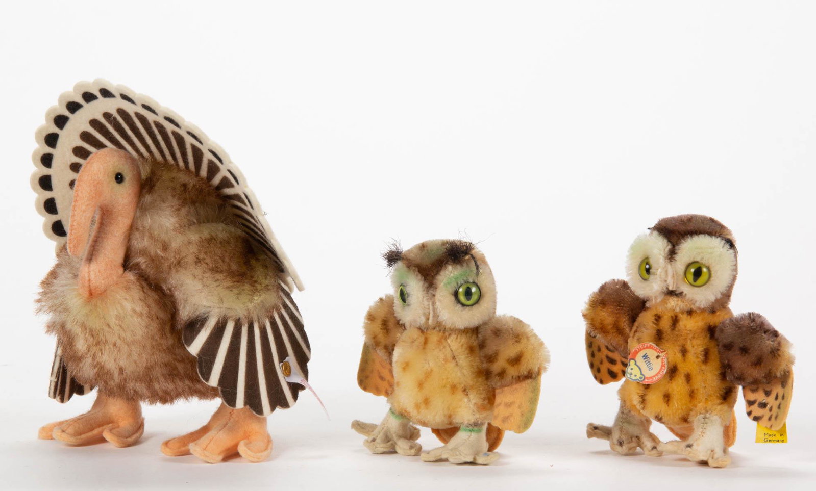 VINTAGE GERMAN STEIFF STUFFED FEATHERED ANIMALS, LOT OF: VINTAGE GERMAN STEIFF STUFFED FEATHERED ANIMALS, LOT OF THREE, mohair, comprising two Wittie owls with bright green eyes and felt feet and wing tips, one with yellow tag marked "4310" and secured by a