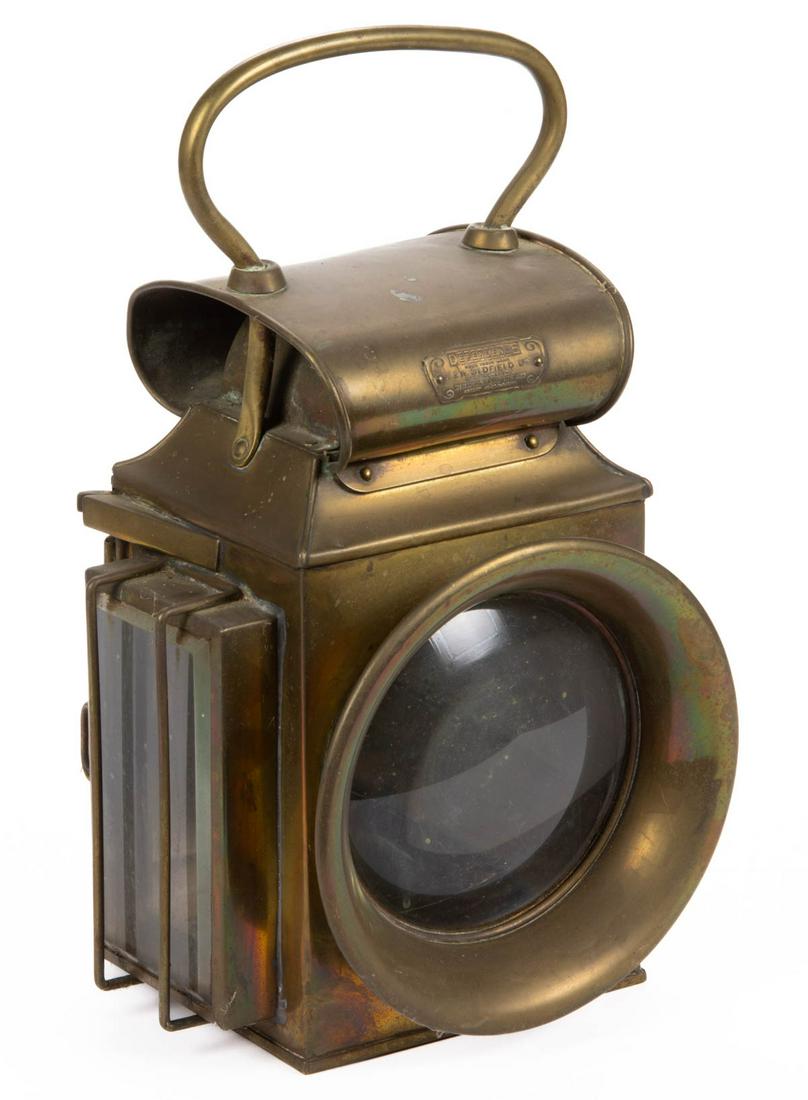 J & R OLDFIELD, ENGLAND, DEPENDENCE BRASS LANTERN /: J & R OLDFIELD, ENGLAND, DEPENDENCE BRASS LANTERN / LAMP, side-lamp example, with original plaque, and applied stationary bail handle. First quarter 20th century. 14" HOA, 6 1/4" D.Provenance: From th