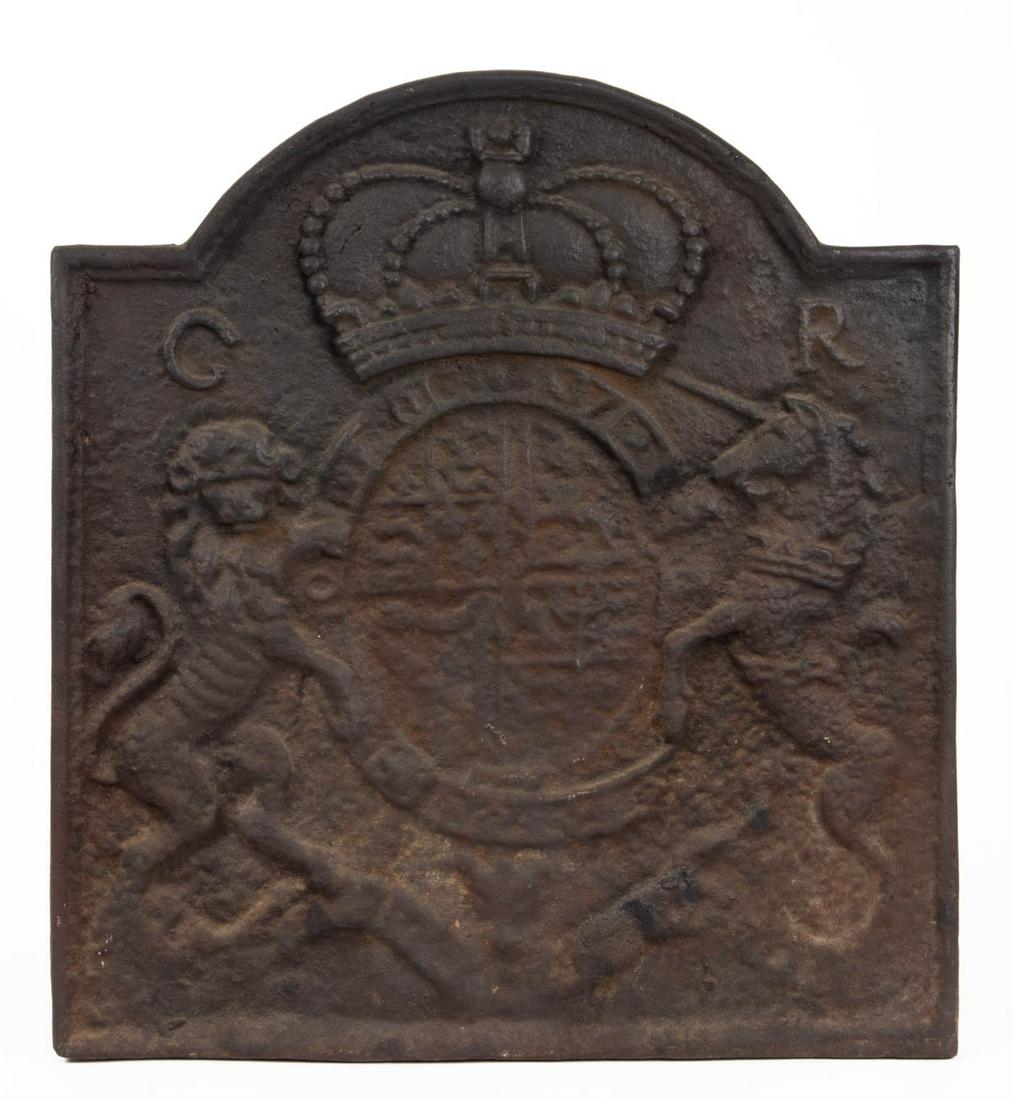 VIRGINIA METALCRAFTERS FOR COLONIAL WILLIAMSBURG: VIRGINIA METALCRAFTERS FOR COLONIAL WILLIAMSBURG CAST-IRON ARCH-TOP FIREBACK, depicting an English Royal Coat of Arms, stamped on the reverse "T. ELSLEY". 20th century. 24" H, 21 3/4" W.Shipping Note: