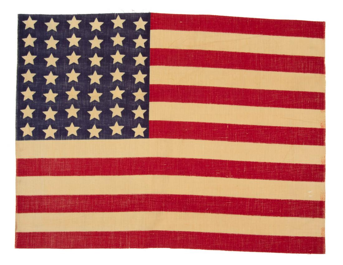 42-STAR UNOFFICIAL AMERICAN NATIONAL WASHINGTON: 42-STAR UNOFFICIAL AMERICAN NATIONAL WASHINGTON STATEHOOD PARADE FLAG, printed glazed cotton muslin, a vibrant example, the blue canton featuring seven rows of five-pointed stars in uniform orientatio