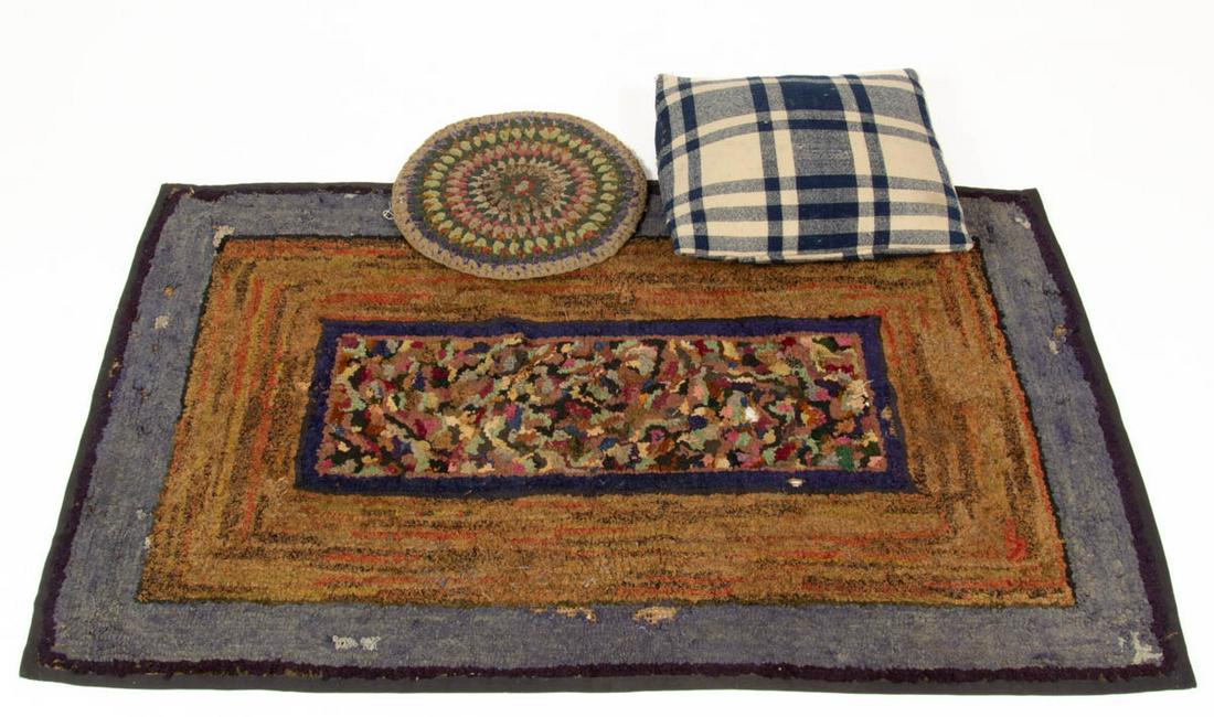 AMERICAN FOLK ART HOOKED RUG: AMERICAN FOLK ART HOOKED RUG, rectangular form, center having geometric field within a blue frame, inner border with various colored fabrics, light and dark blue outer border, applied binding to edges
