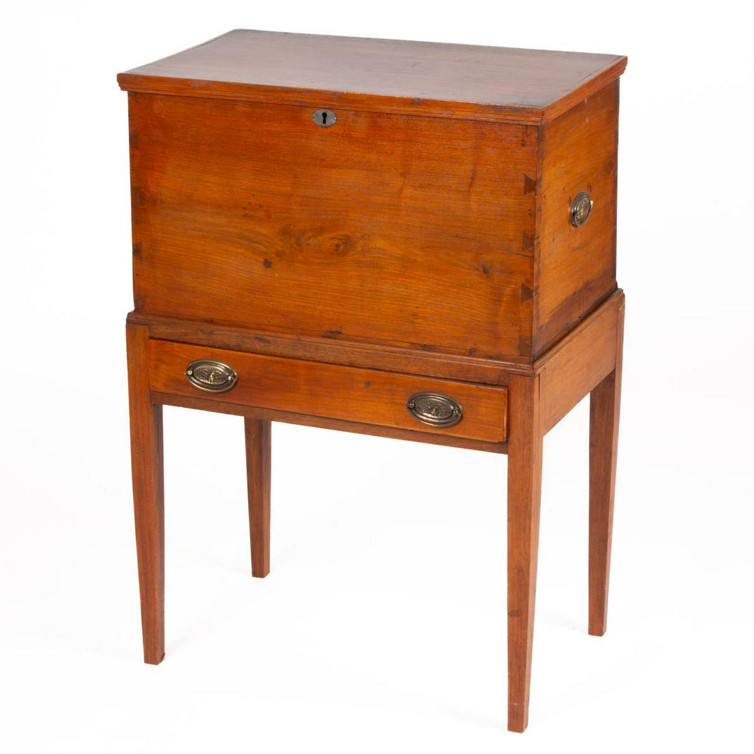 MID-ATLANTIC WALNUT CELLARETTE: MID-ATLANTIC WALNUT CELLARETTE, rectangular hinged lid with applied moldings, above case with lidded till, over full-length drawer with later brass eagle pulls, raised on square tapered legs. Poplar a