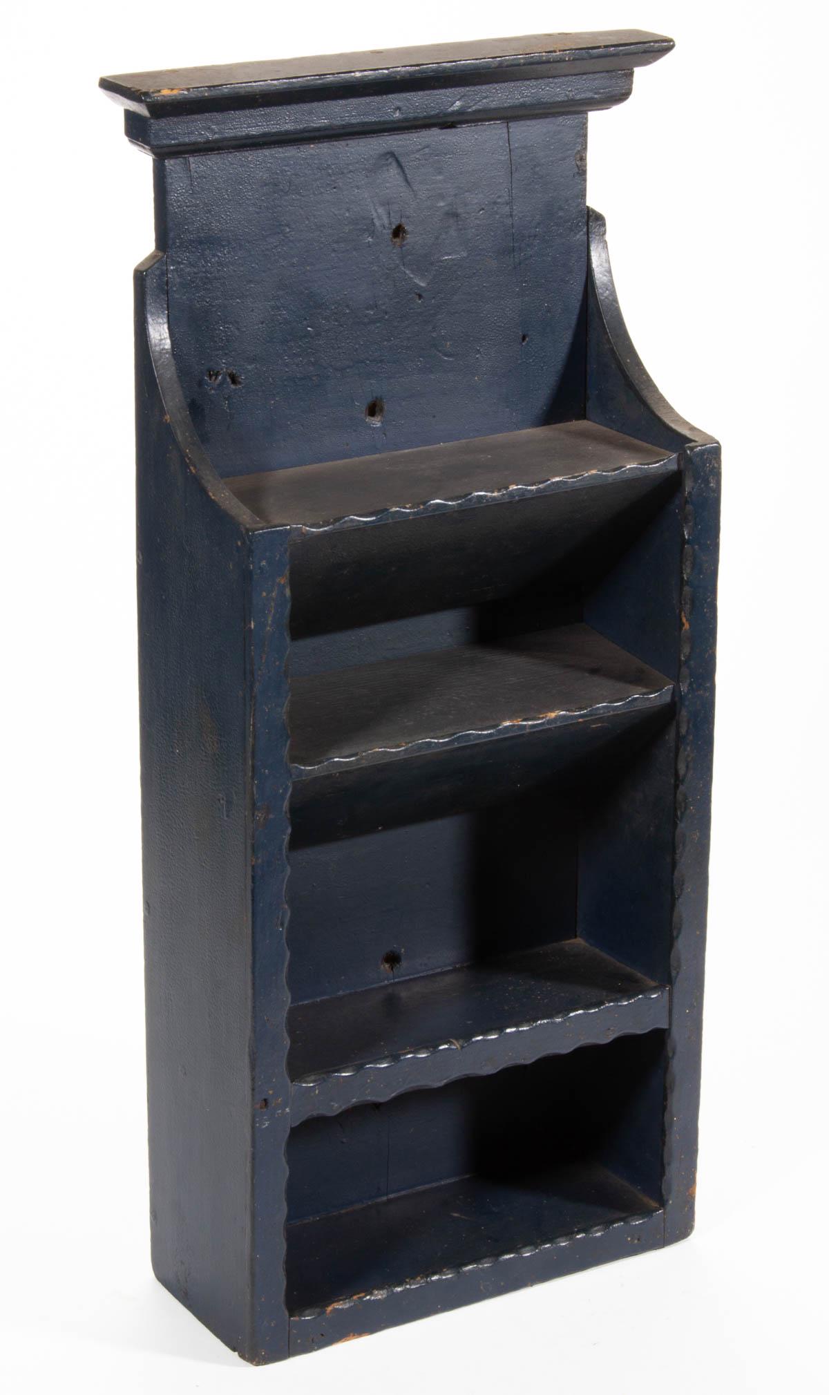MID-ATLANTIC PAINTED POPLAR HANGING SHELF: MID-ATLANTIC PAINTED POPLAR HANGING SHELF, applied molded cornice above four shelves. Old blue-painted surface. Late 19th/early 20th century. 22 1/2" H, 11" W, 4 1/4" D. Provenance: From a Washington,