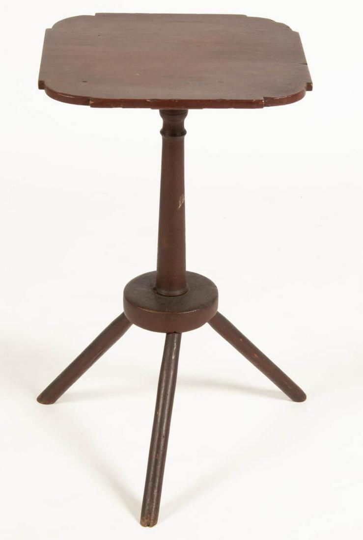 AMERICAN CHIPPENDALE PAINTED MIXED-WOOD CANDLESTAND: AMERICAN CHIPPENDALE PAINTED MIXED-WOOD CANDLESTAND, square cut-corner top over baluster-turned pedestal, raised on a tripod base. Retains an early red-painted surface. Late 18th century. 26 3/4" H, 1